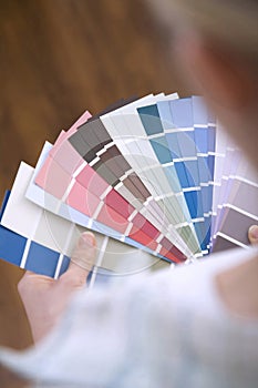 Selecting paint colour for new home. Conceptual image