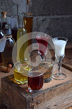 Selection of alcoholic drinks. Set of wine, brandy, liqueur, tincture, cognac, whiskey in glasses, bottles. Large variety of alcoh