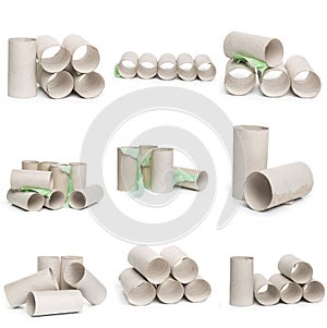 A selection of cardboard toilet paper tubes in various arrangements isolated on a white background