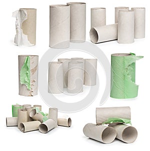 A selection of cardboard toilet paper tubes in various arrangements isolated on a white background
