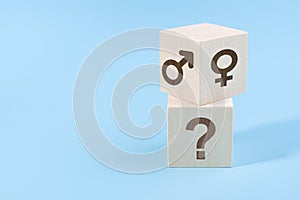 Selection or changing gender concept. hand turns cube with the male and female icons over the cube with question icon