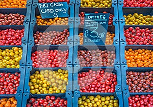 A selection of cherry tomatoes on a market stand