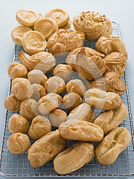 Selection of Choux Pastry Buns on a Cooling Rack