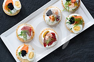 Selection of cocktail blinis - gourmet party food