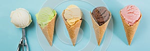 Selection of colorful ice cream scoops on blue background