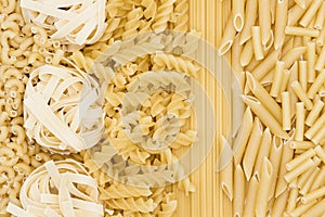 Selection of different pasta types on a white background. Healthy organic flat lay