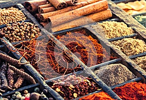 Selection of dried spices in a printers tray