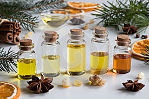 Selection of essential oils with Christmas spices and ingredient