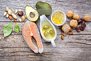 Selection food sources of omega 3 and unsaturated fats. Super foods high vitamin e and dietary fiber for healthy food on wooden