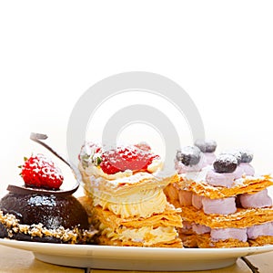 Selection of fresh cream cake dessert plate