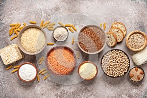 Selection of gluten free food on a rustic background. A variety of grains, flours, pasta, and bread gluten-free. Top view, flat