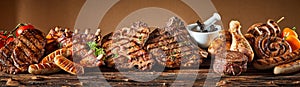 Selection of grilled gourmet meats on timber photo