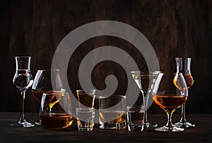 Selection of hard strong alcoholic drinks in big glasses and small shot glass in assortent: vodka, cognac, tequila, brandy and