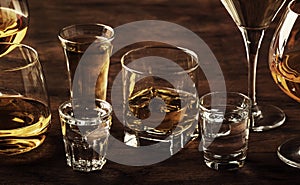 Selection of hard strong alcoholic drinks in big glasses and small shot glass in assortent: vodka, cognac, tequila, brandy and