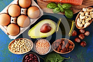 Selection of healthy food for heart, life concept with eggs and avocado on background