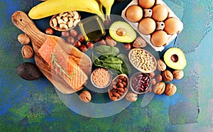 Selection of healthy food for heart, life concept with eggs and avocado on background