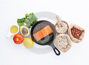 Selection of healthy food. Salmon fish, nuts, pepper, fruits and