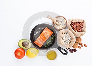 Selection of healthy food. Salmon fish, nuts, pepper, fruits and
