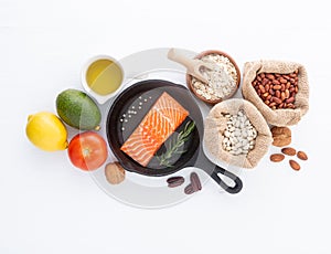 Selection of healthy food. Salmon fish, nuts, pepper, fruits and