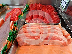 Selection of high quality meat products of sausages chicken lamb pork beef pheasant duck geese at the privately owned butchers