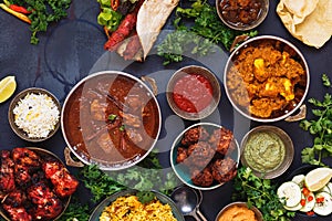 Selection of Indian food with various bowls of food