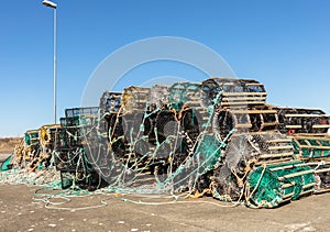 A selection of lobster pots on land, in the small fishing village Lista, Norway photo