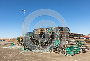 A selection of lobster pots on land, in the small fishing village Lista, Norway photo