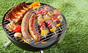 Selection of meat on a portable barbecue