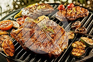 Selection of meat and vegetables on a barbecue