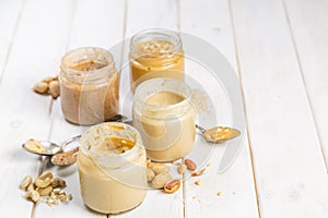 Selection of nut butters - peanut, cashew, almond and sesame seeds