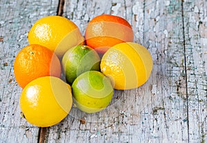 Three citrus fruits grouped on the floor photo