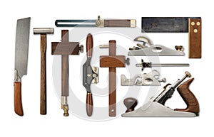 A selection of precision carpentry tools on a white backdrop