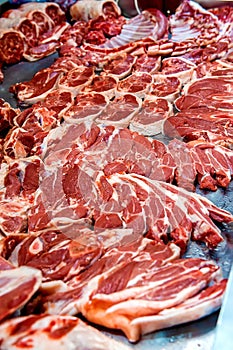 Selection of quality meat in a butcher shop. Different types of fresh meat are on display. Meat assortment
