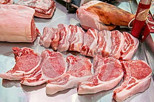 Selection of quality meat in a butcher shop. Different types of fresh meat are on display. Meat assortment