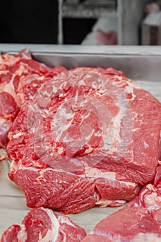 Selection of quality meat in a butcher shop. Different types of fresh meat are on display. Meat assortment