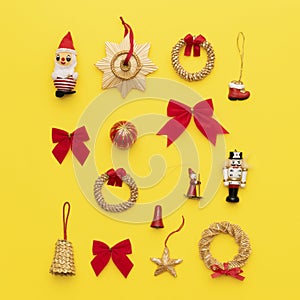 Selection of retro christmas ornaments isolated on bright yellow background.