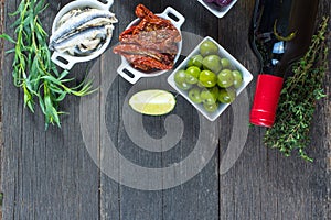Selection of spanish tapas with red wine from above