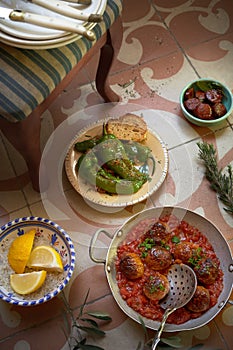 Selection of Spanish tapas on a tiled floor photo