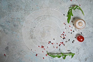 Selection of spices herbs and greens. Ingredients for cooking. Food background on black slate table.