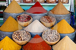 Selection of spices on a traditional Moroccan market souk in Marrakech, Morocco