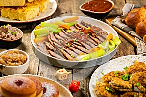 Selection of traditional hanukkah food for festive dinner, wood background