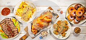 Selection of traditional hanukkah food for festive dinner, wood background