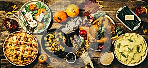 Selection of traditional thanksgiving food - turkey, mashed patatoes, green beans, apple pie on rustic background