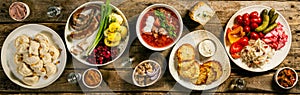 Selection of traditional ukrainian food - borsch, perogies, potato cakes, pickled vegetables