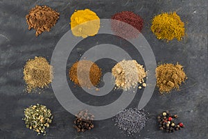 Selection of various spice on slate background