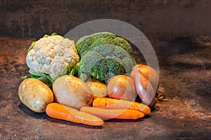 Selection of vegetables against a dark background photo