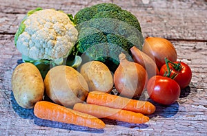 Selection of vegetables on floorboards photo