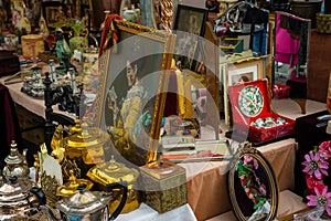 Antiquities at flea market, selection of vintage things, antique stuff photo