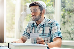 Selectiv focused of health insurance card holding in hands of muslim businessman wearing kufi hat working at home