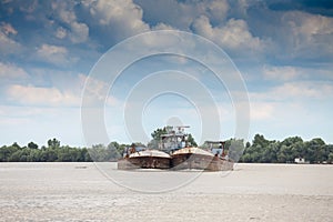 Selective blur Cargo ship, a barge, oil tanker, cruising on the Danube river in Serbia, in belgrade, carrying petrol and chemicals